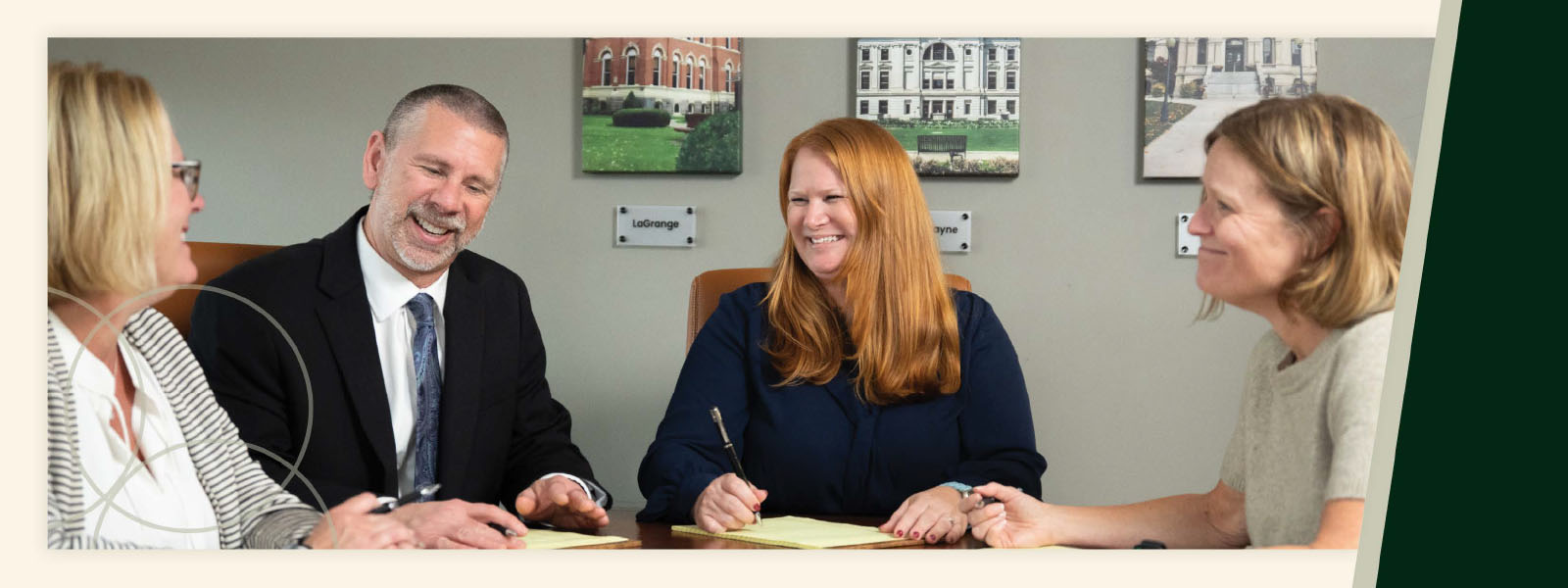 Troy Kiefer Seminar banner | Beers Mallers Group of four professionals at a meeting, smiling as they sign papers together on a conference table.
